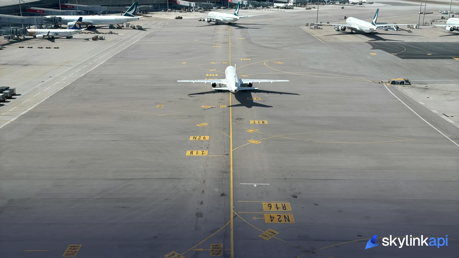 Airplane parked on the tarmac near airport terminal buildings during dispatch operations