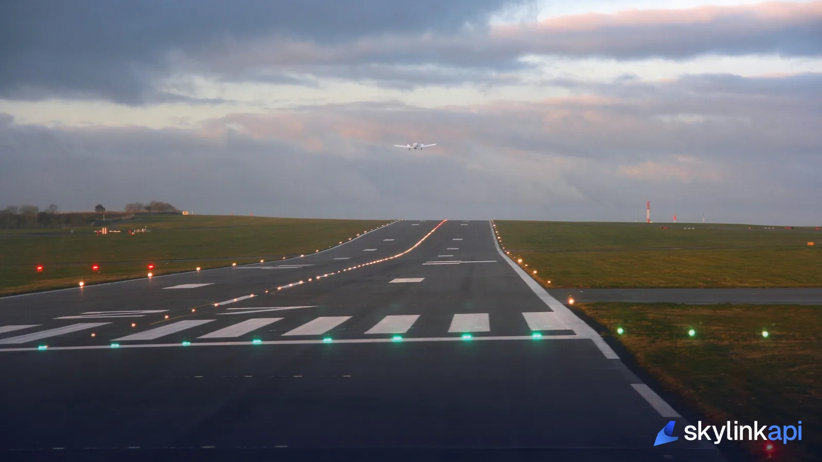 A runway with its markings, threshold, and approach lights — the kind of facility data the API returns
