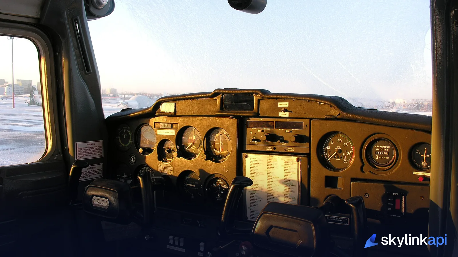 The cockpit of a Cessna 150 on an early winter morning