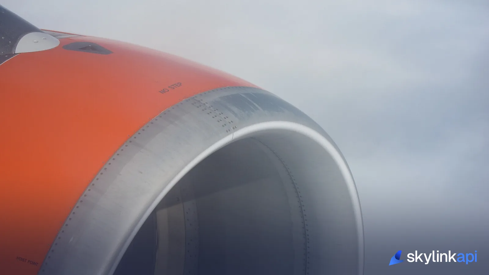 A close-up of an airliner's turbofan engine intake and nacelle
