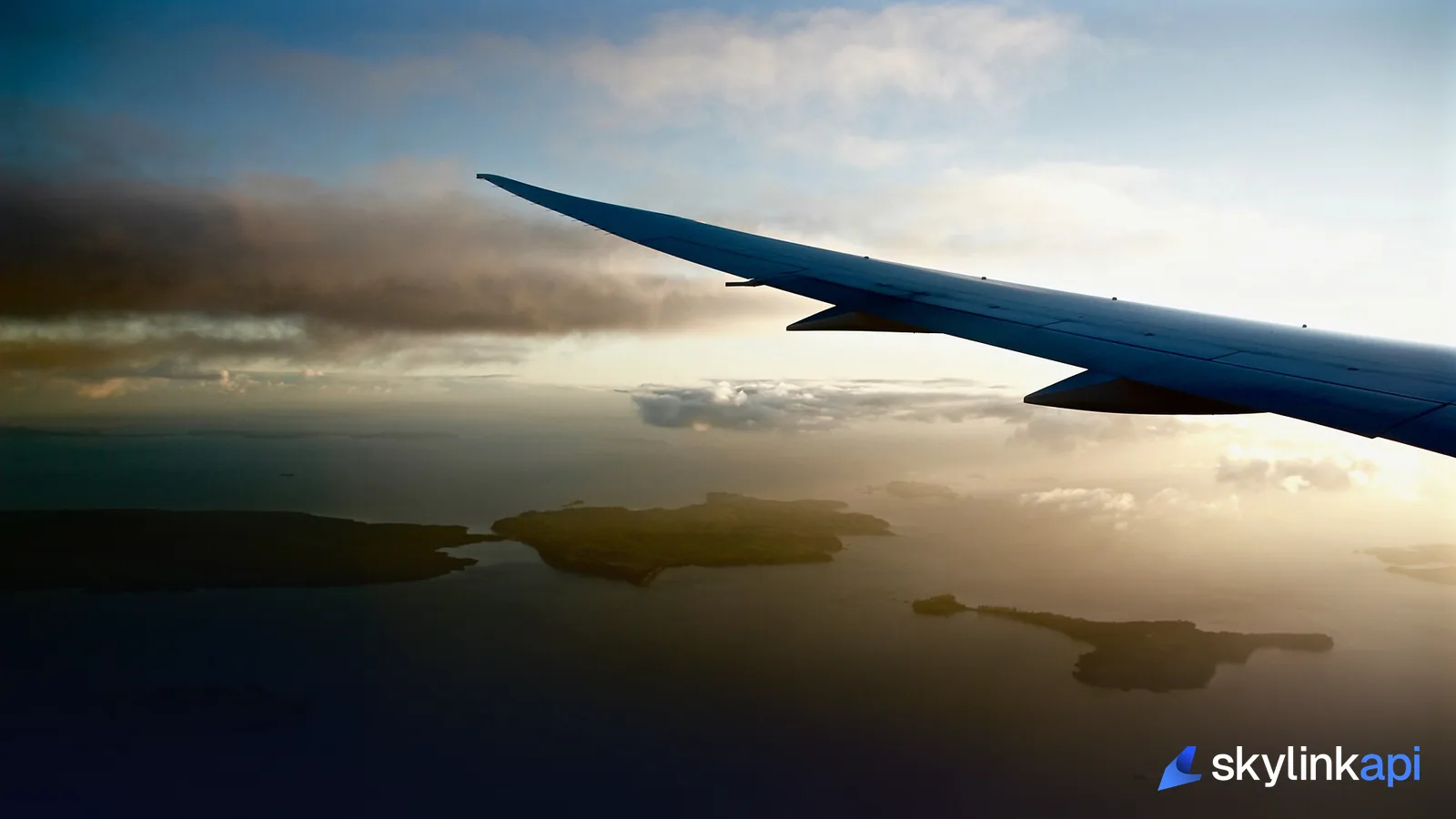 An airliner's wing over open water — the overwater flying ETOPS clears twins to do