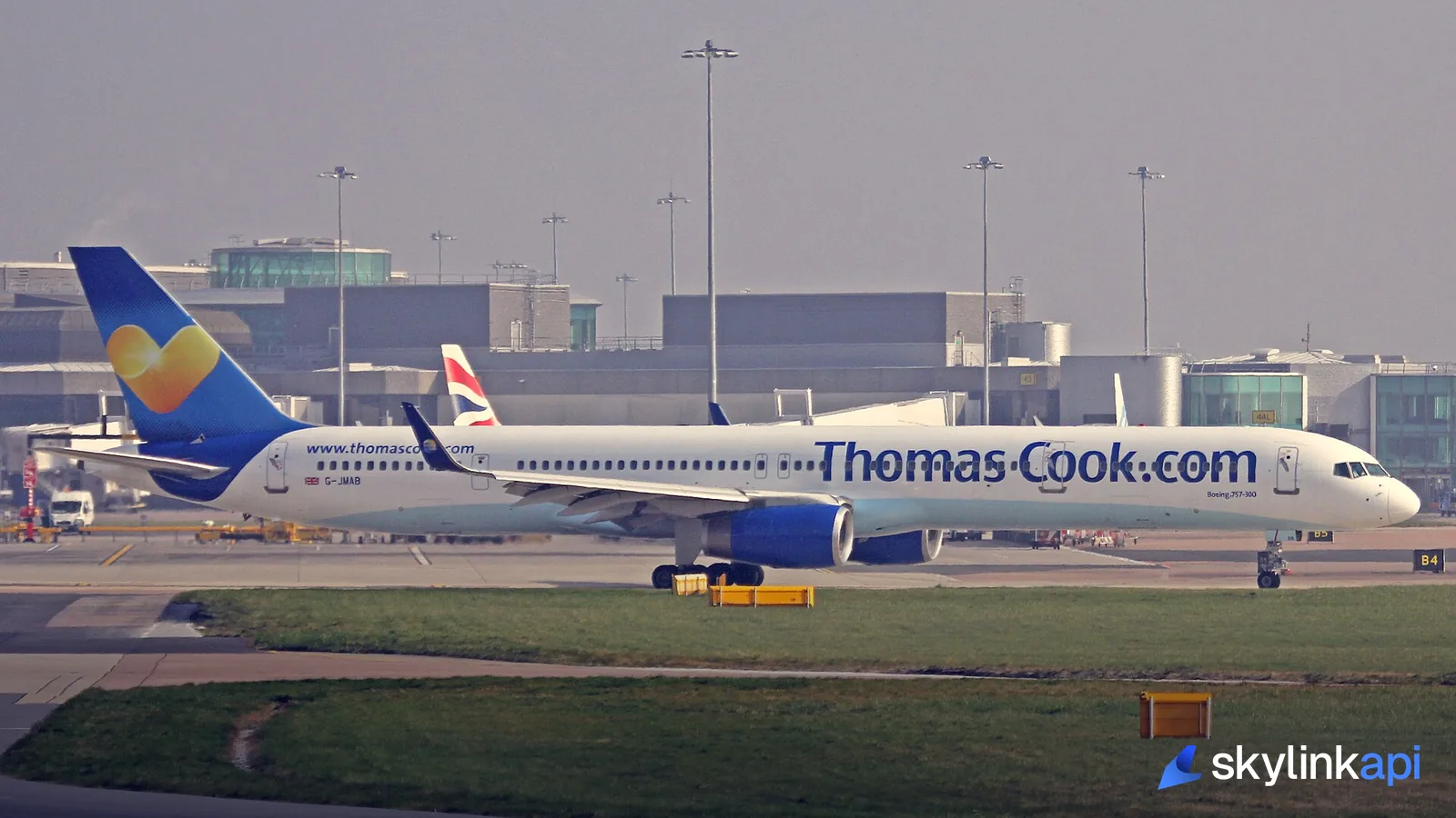 An airliner on the apron with the terminal behind — where the delay is actually experienced