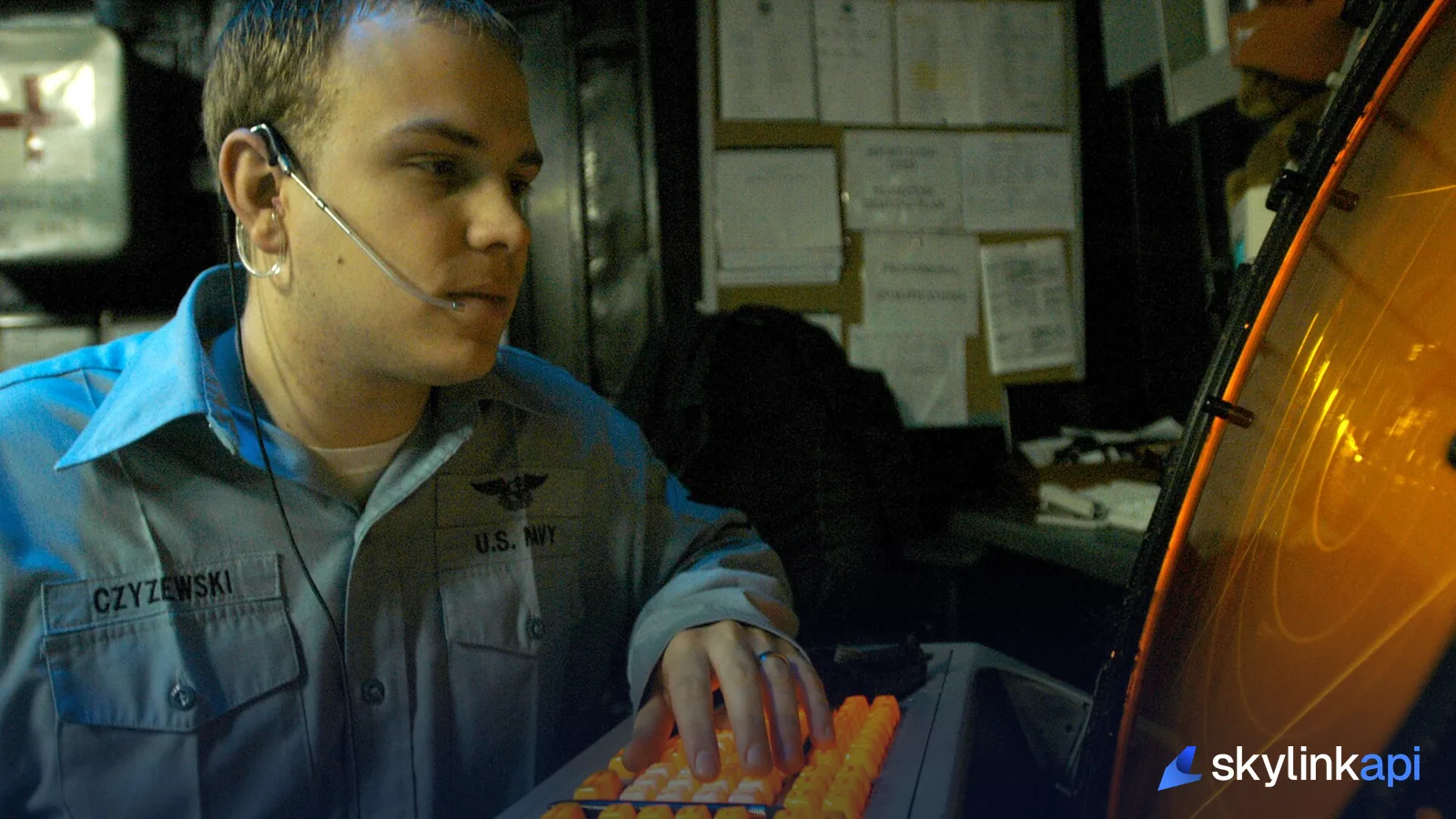 An air traffic controller monitoring aircraft on a circular radar scope