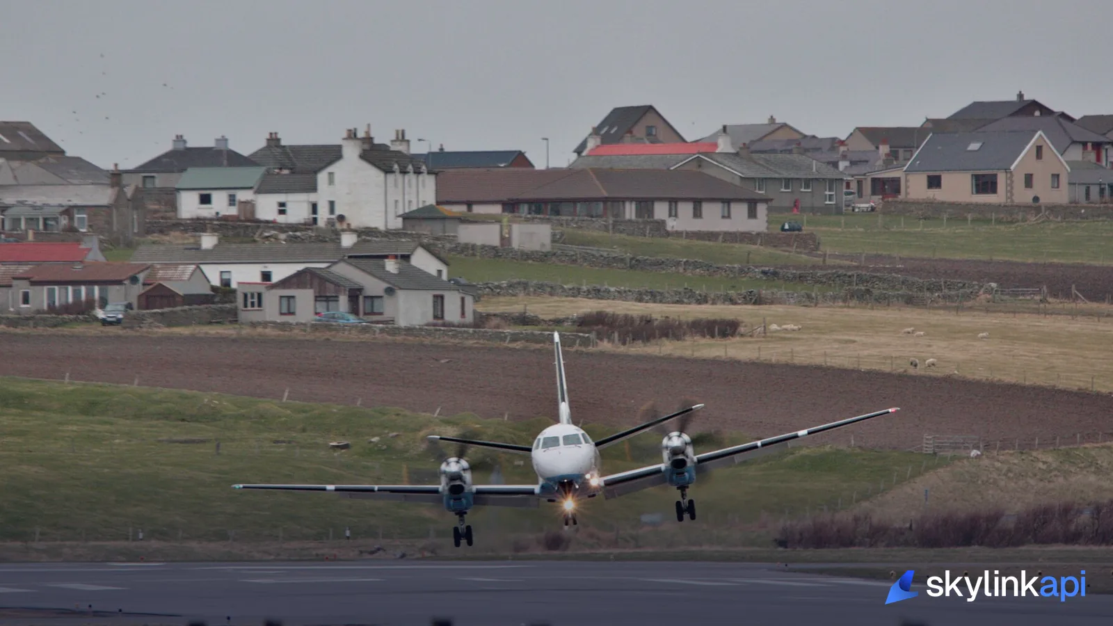 An airliner on short final over the runway threshold