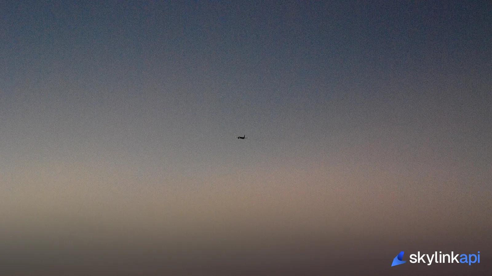A Boeing 757 climbing away after sunset