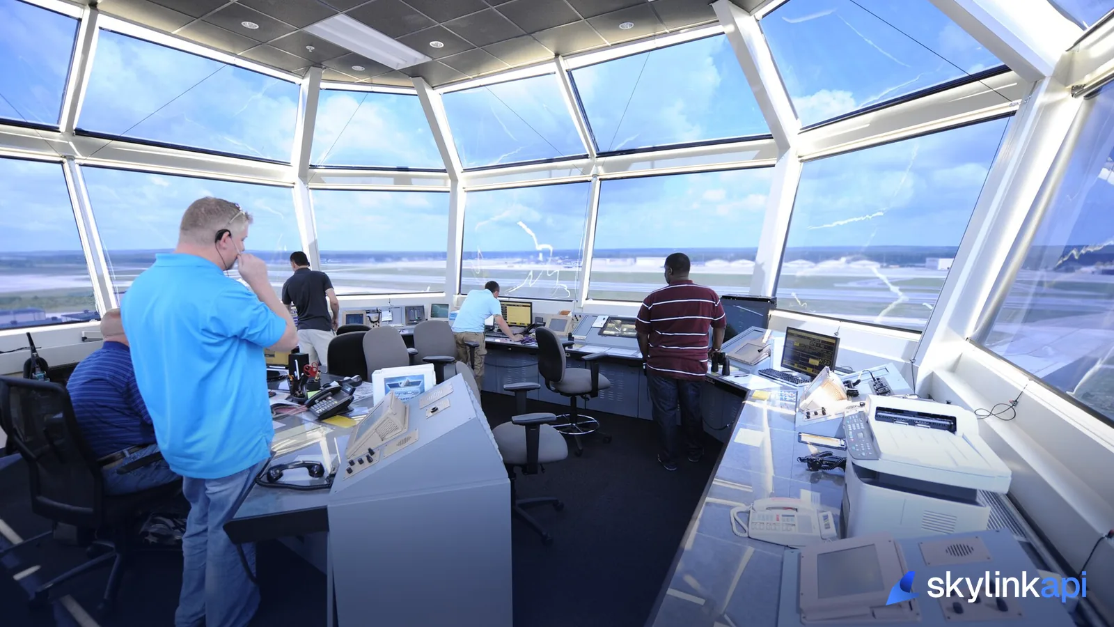 Controllers at work inside an airport tower cab