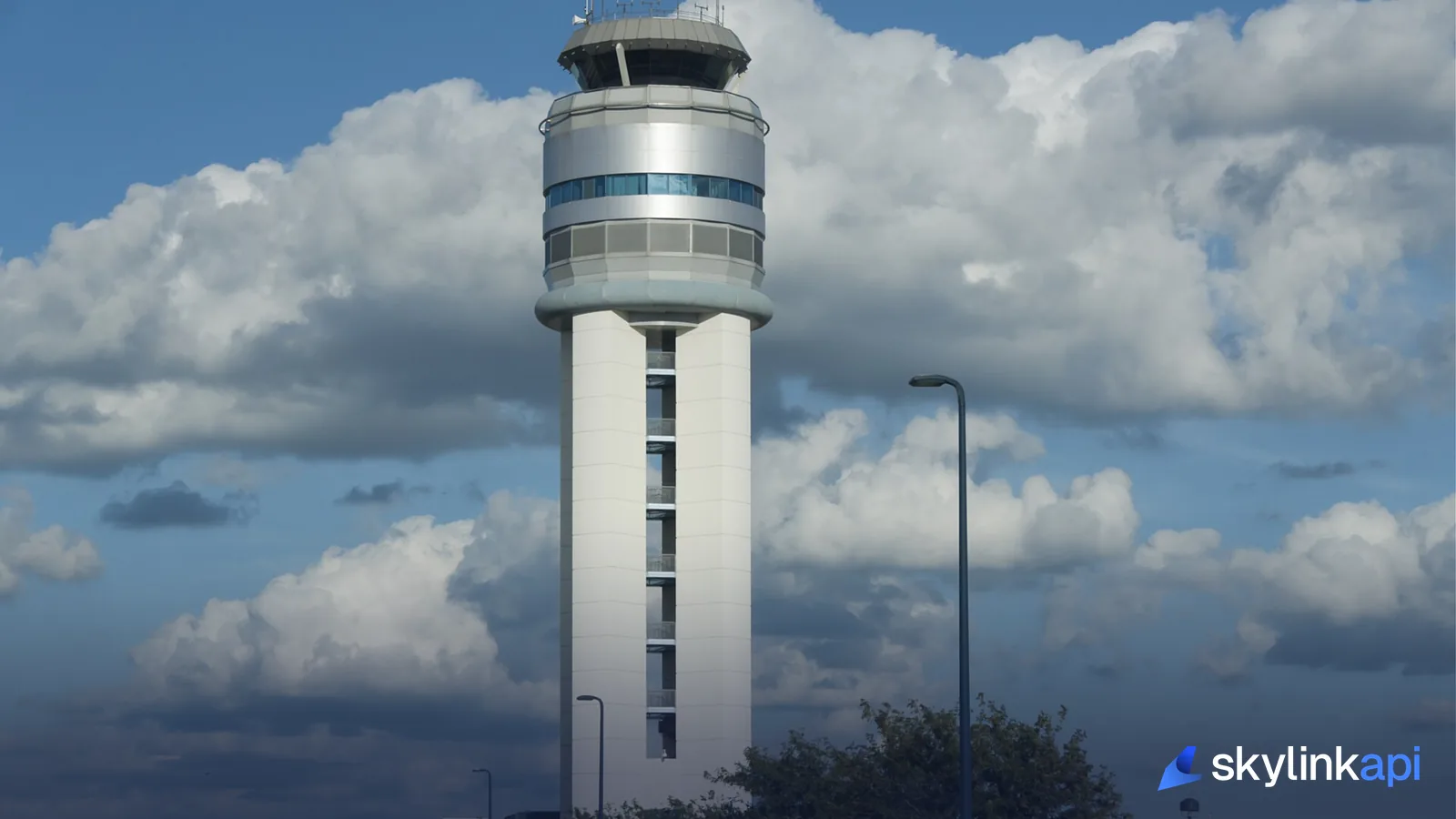 An airport control tower against the sky