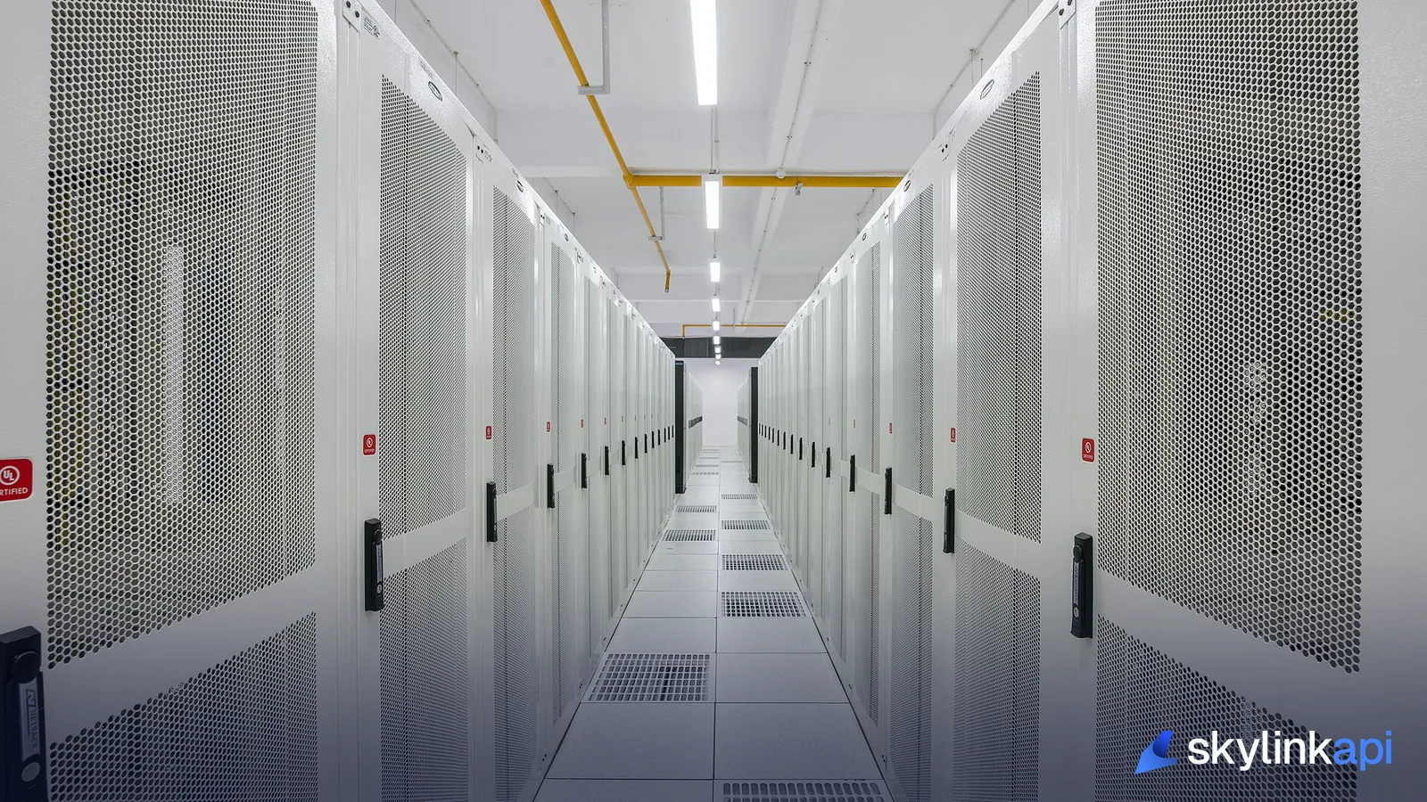 Server racks in a white-walled data centre aisle