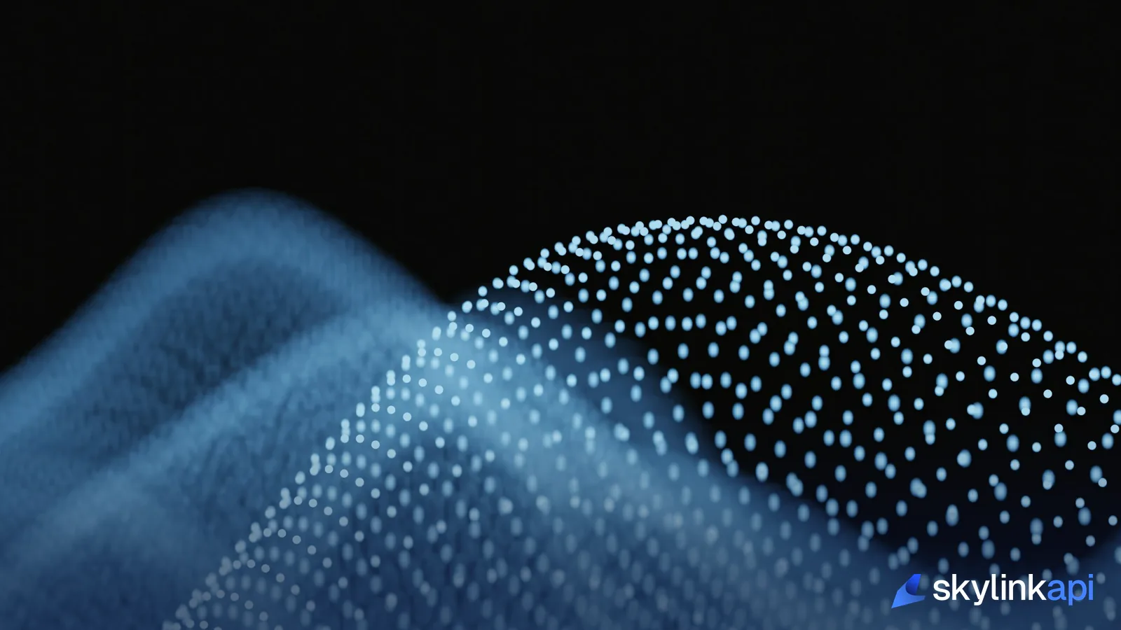 Abstract glowing blue particle waves representing a stream of live structured data