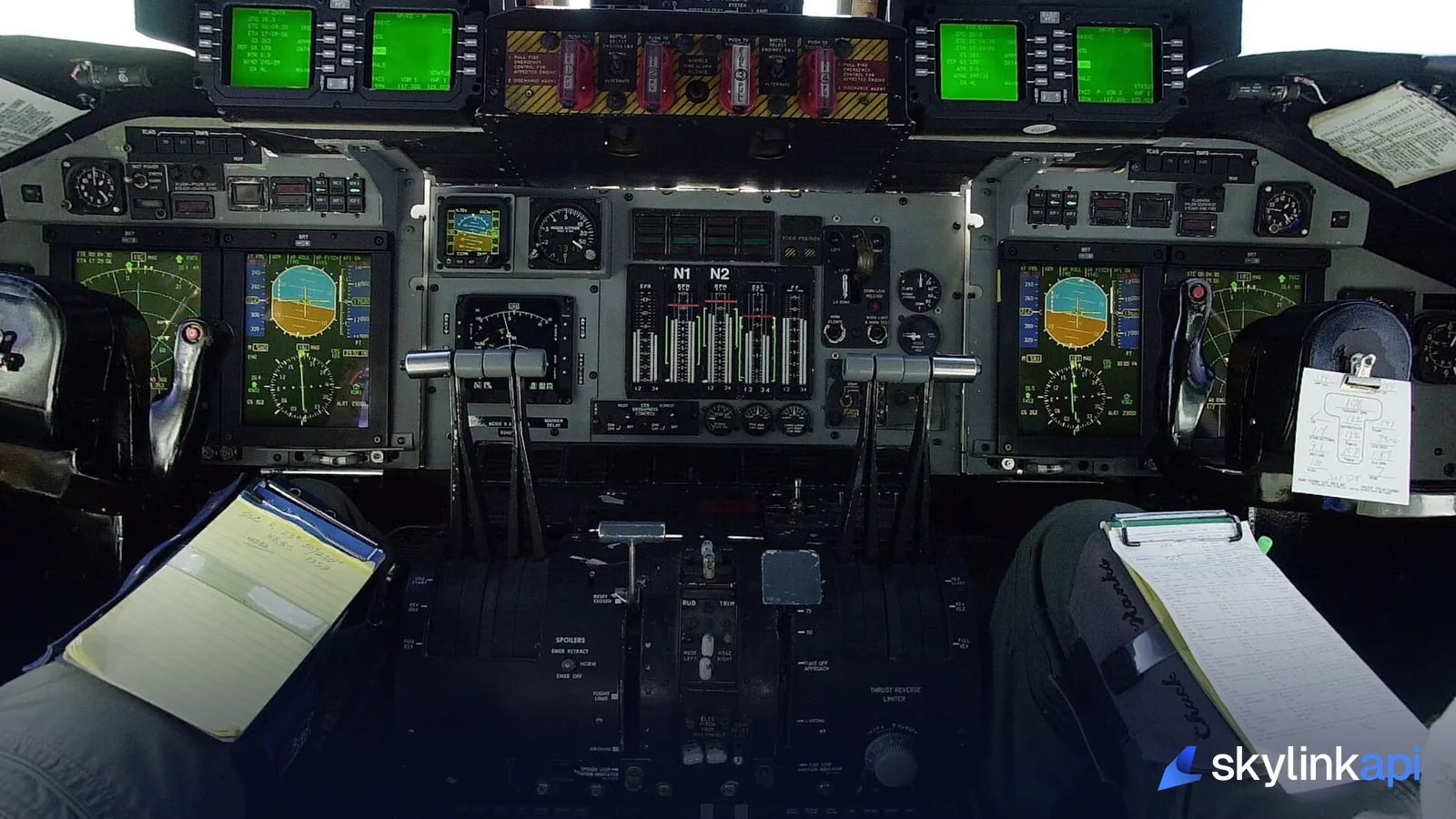 The flight deck of an aircraft showing glass-cockpit avionics and transponder controls