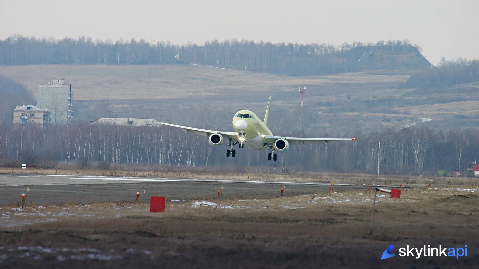 An aircraft lifting off from a runway