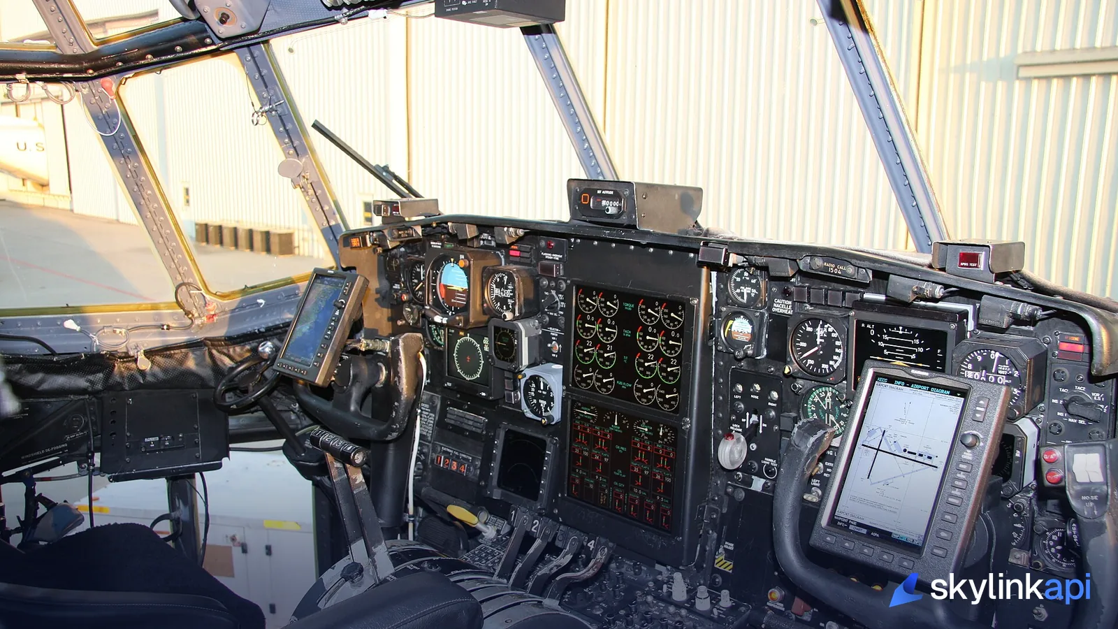View across airliner cockpit instruments and displays in flight