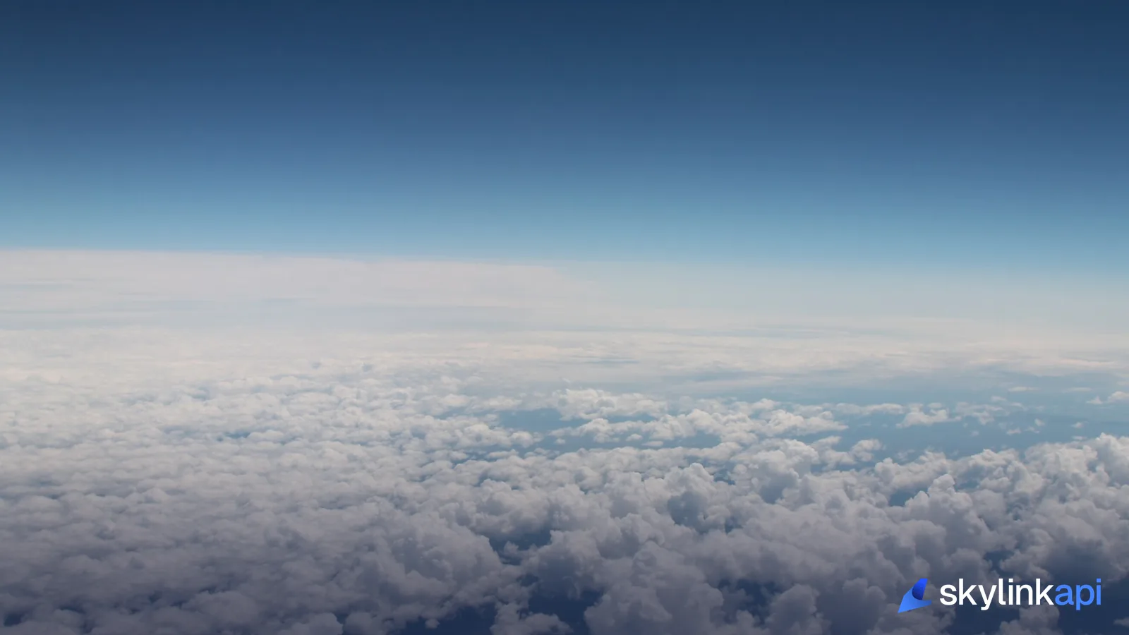 A layer of cumulus cloud seen from an airplane window in flight